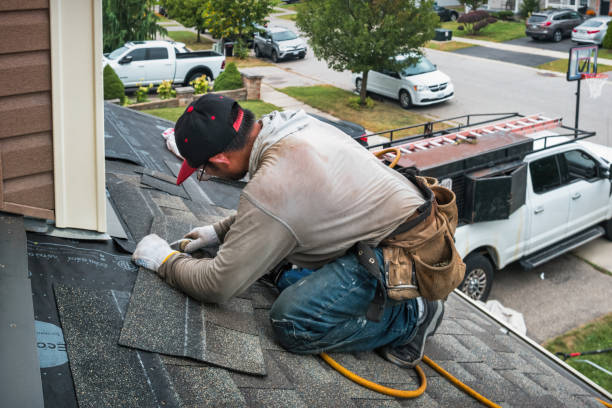 Professional Roofing technician working in North Oxford, MA